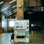 a vending machine sitting in the middle of an airport